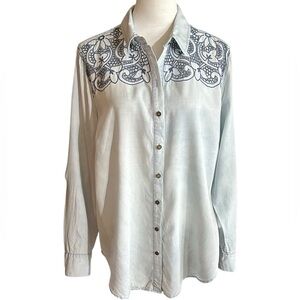 A very pretty Ariat shirt with intricate open stitch work on the front.